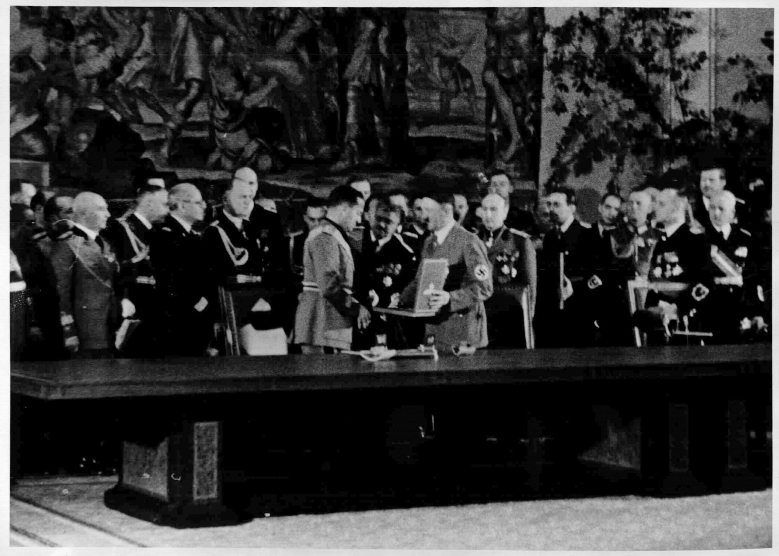 Adolf Hitler presents the Grand Cross of the German Eagle Order to Italian Foreign Minister Ciano after the signing of the German-Italian Alliance Pact in the Reich Chancellery